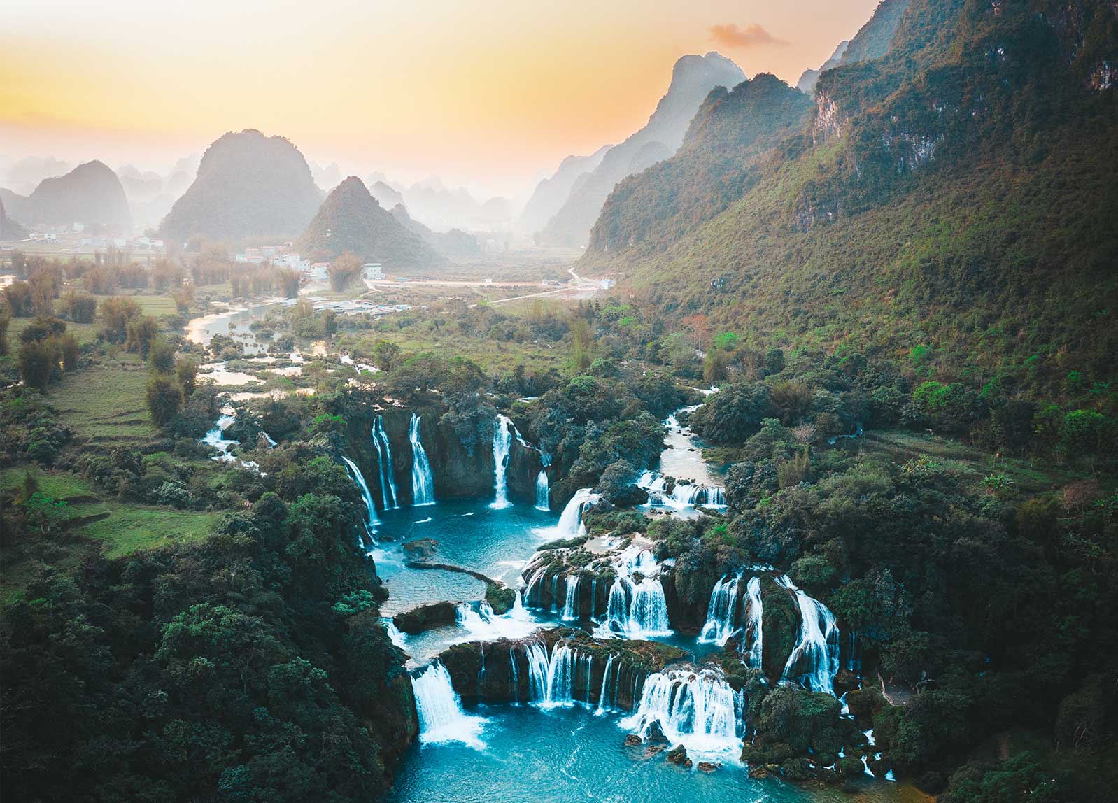 Iguazu Falls waterfall and surrounding forest at sunrise