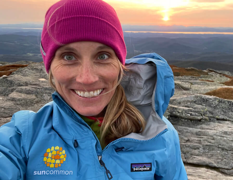 Suncommon senior accounting manager Robin Gresham selfie at sunset on a mountain